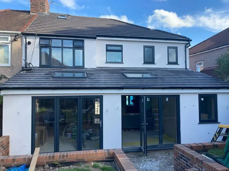 Rear of a house and extension finished in white render