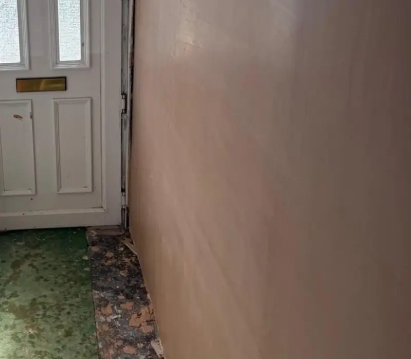 Freshly skimmed wall with a smooth, even plaster finish ready for decorating
