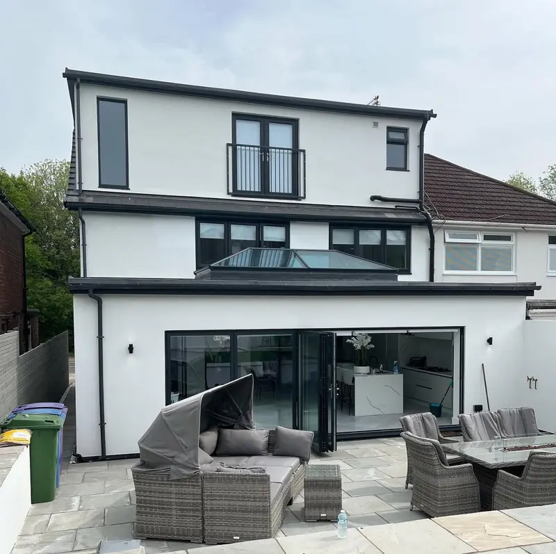 Rear of a house and extension finished in white render