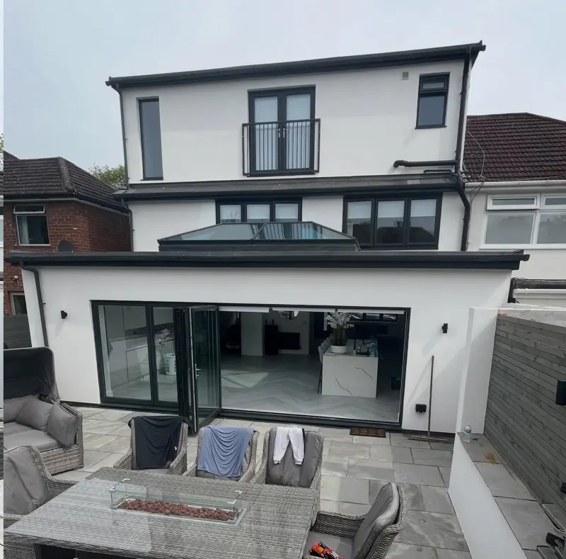Rear of a house and extension finished in white render