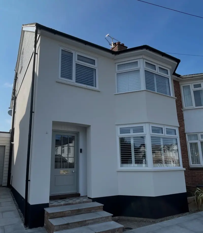 House front rendered white with a crisp, even finish