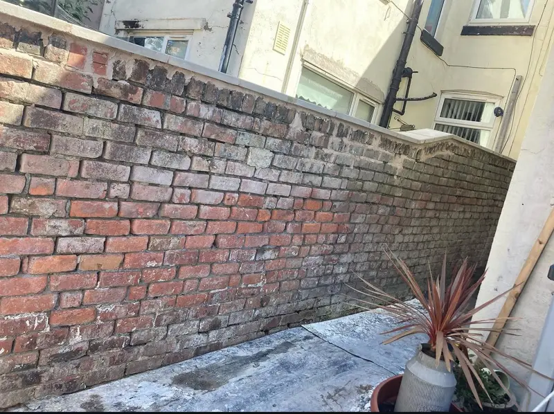 Brick garden wall before rendering