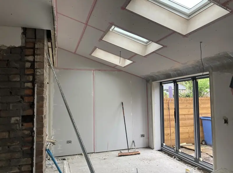New extension boarded and plastered, ready for decoration
