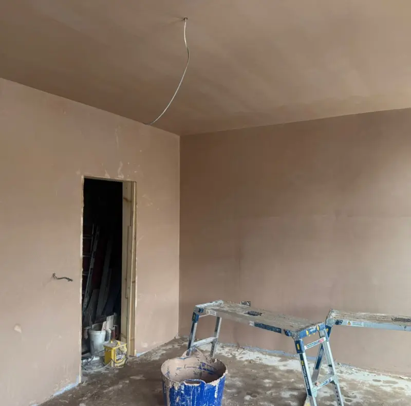 Room with newly plastered walls, drying out before decoration