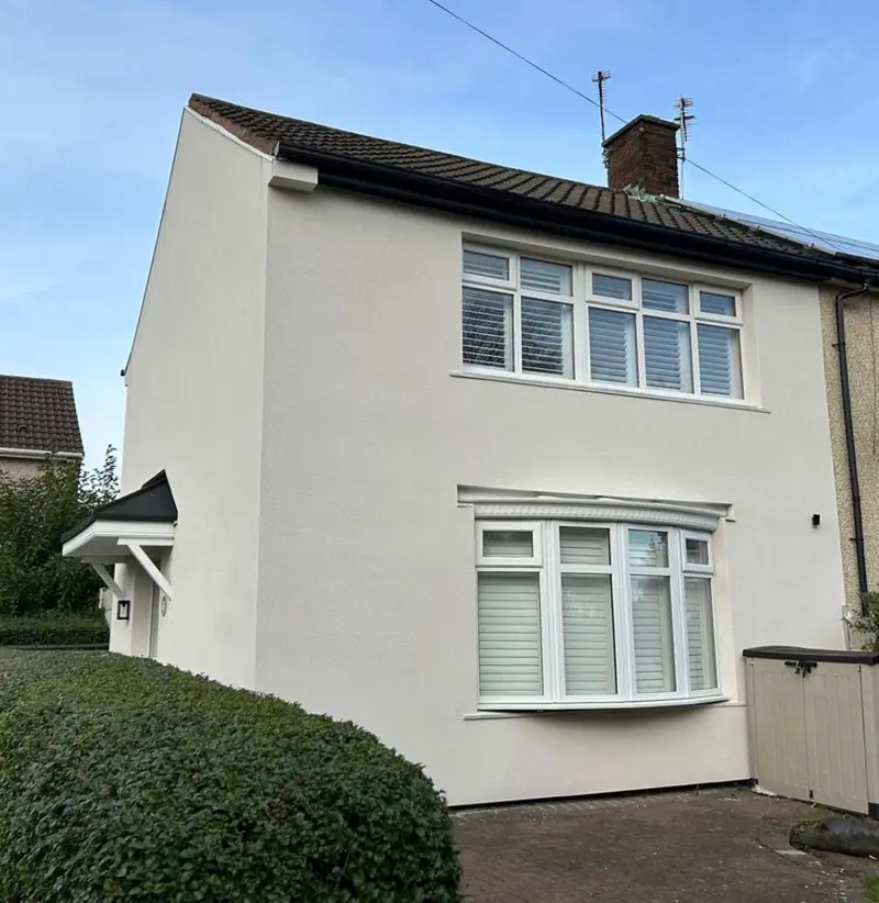 House front rendered white with a crisp, even finish