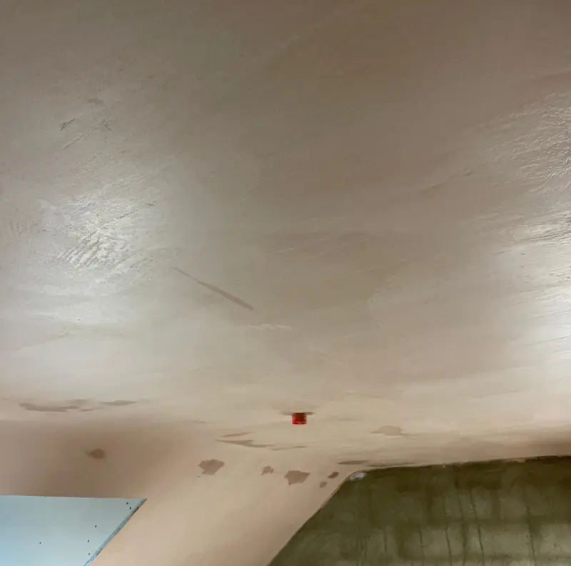 Sloped ceiling skimmed to a smooth finish in a loft room